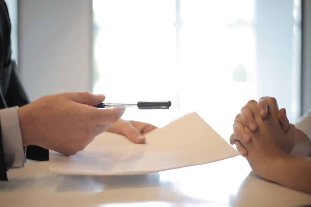 medium-person-holding-pen-and-peper-and-person-with-hands-crossed | Specialized Indianapolis person holding pen and paper and person with hands crossed