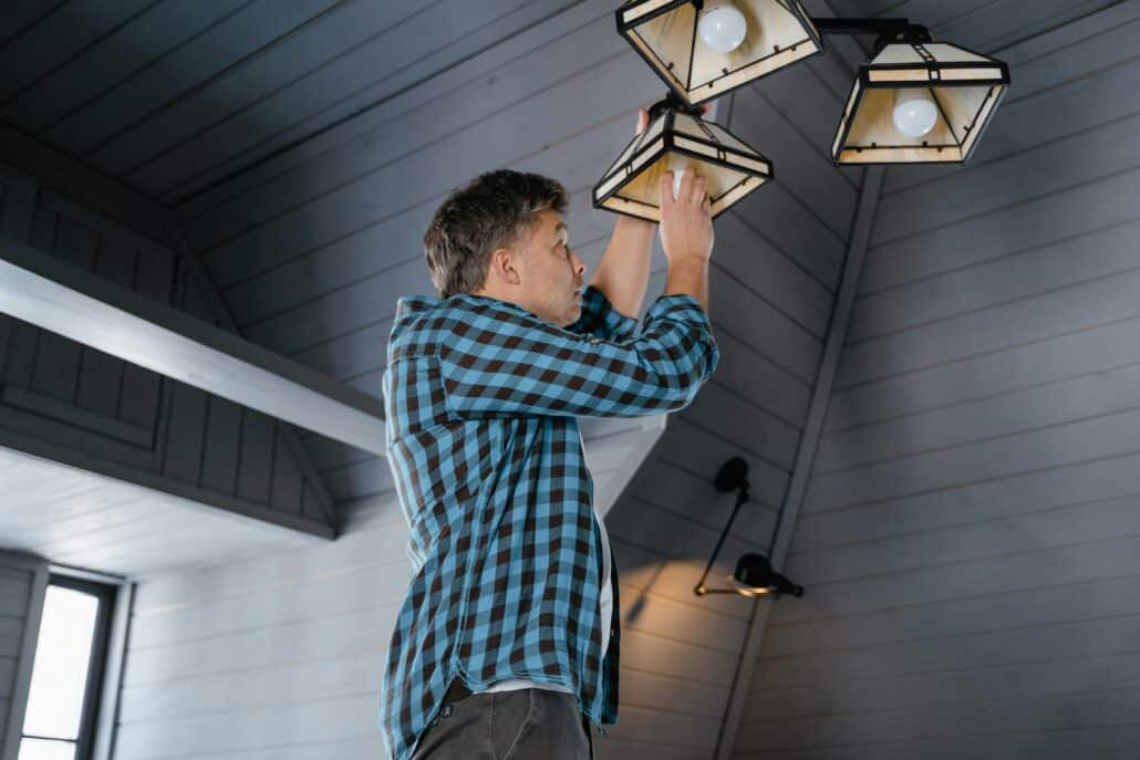 pexels-mart-production-7641361 2 | Specialized Indianapolis man changing lightbulbs in a grey attic